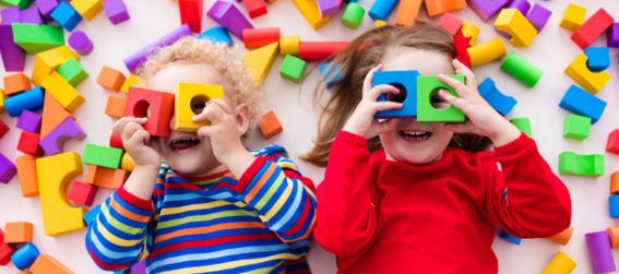 children playing with colorful blocks